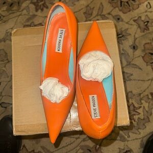 Orange , Steve Madden pumps.